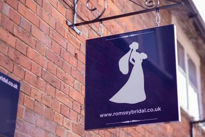 About 2 Romsey Bridal boutique interior showcasing elegant wedding dresses on display.